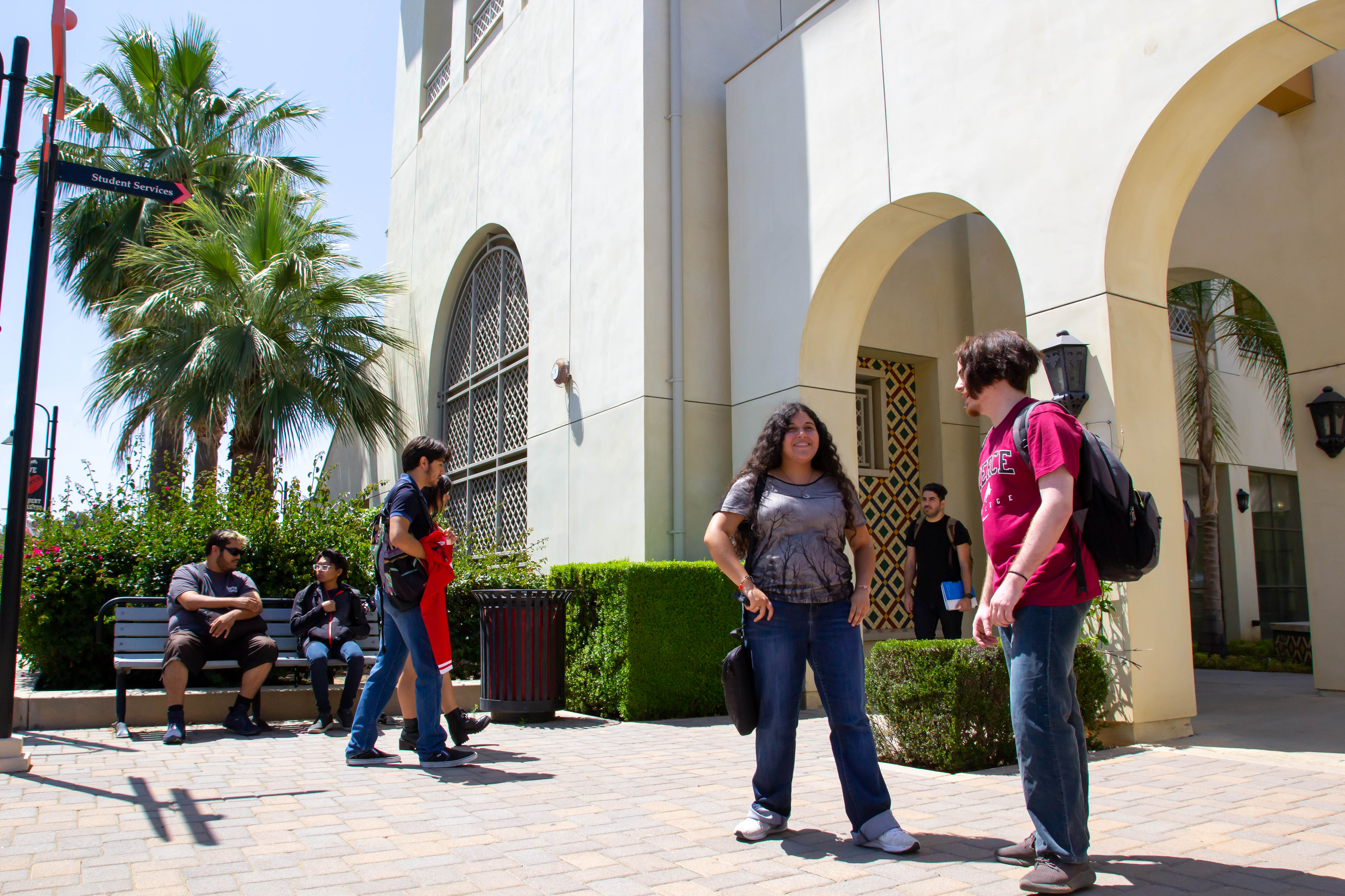 Student Talking Outside of Building