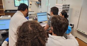 Pierce students operating HPLC machine