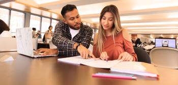 Two Student at Library Reading Notes