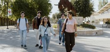 Five Students Walking on Campus