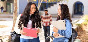 Two Female Students Smiling