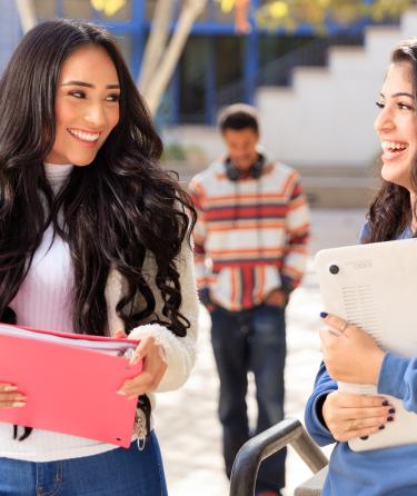 Two Women Students Laughing