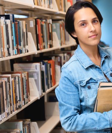 Young Student Taking Book at Library