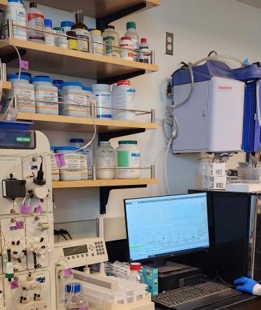 Pierce students operating FPLC machine to purify recombinant protein