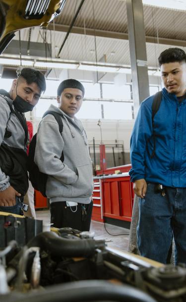 Students Observing a Car