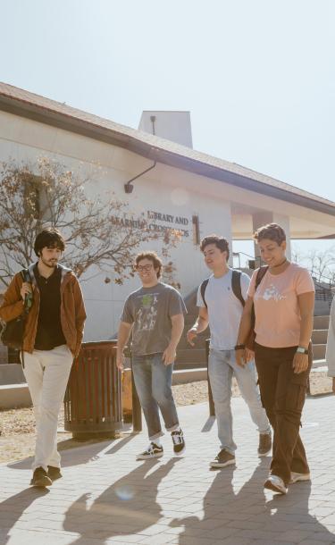 Five Students Walking on Campus