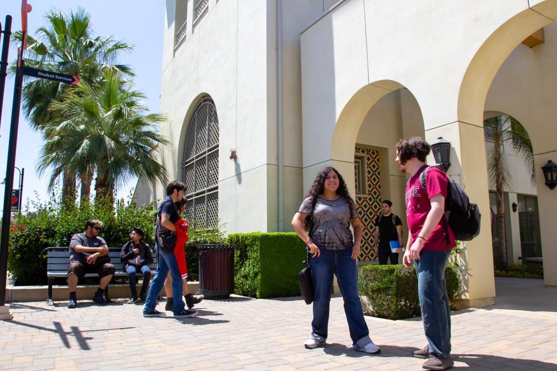 Student Talking Outside of Building