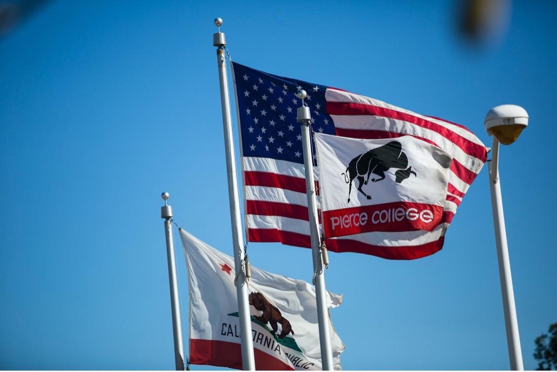 American, California and Pierce flags waving