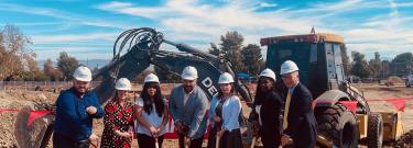 groundbreaking group with shovels and dirt