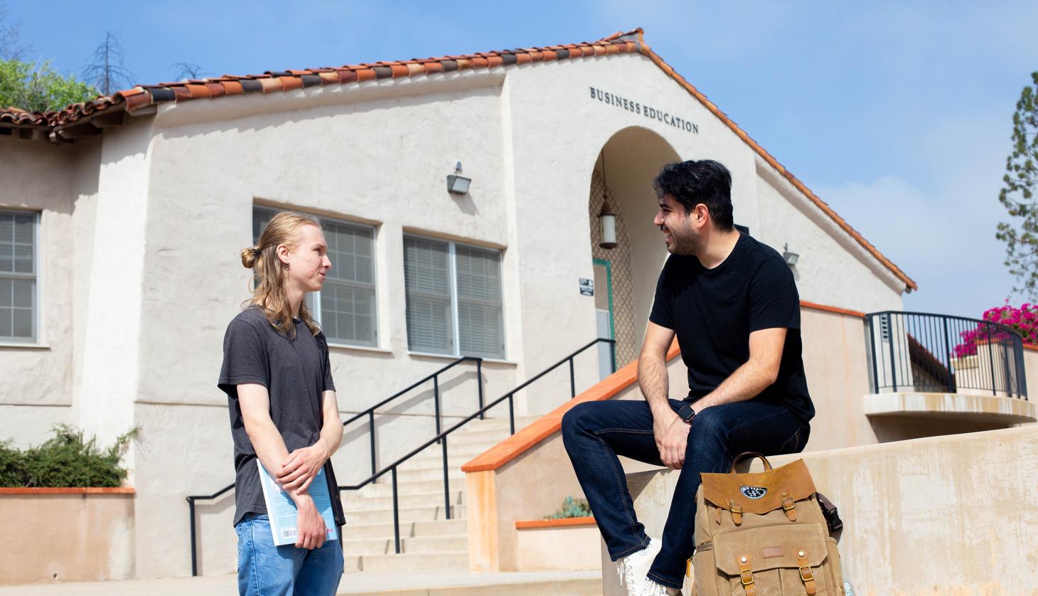 Two Men Talking at Campus