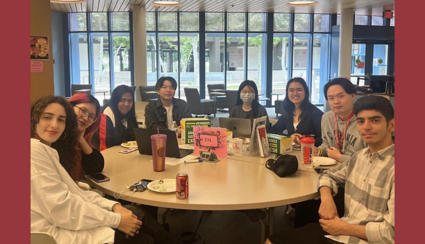Various ESL tutors at a circular tutoring table