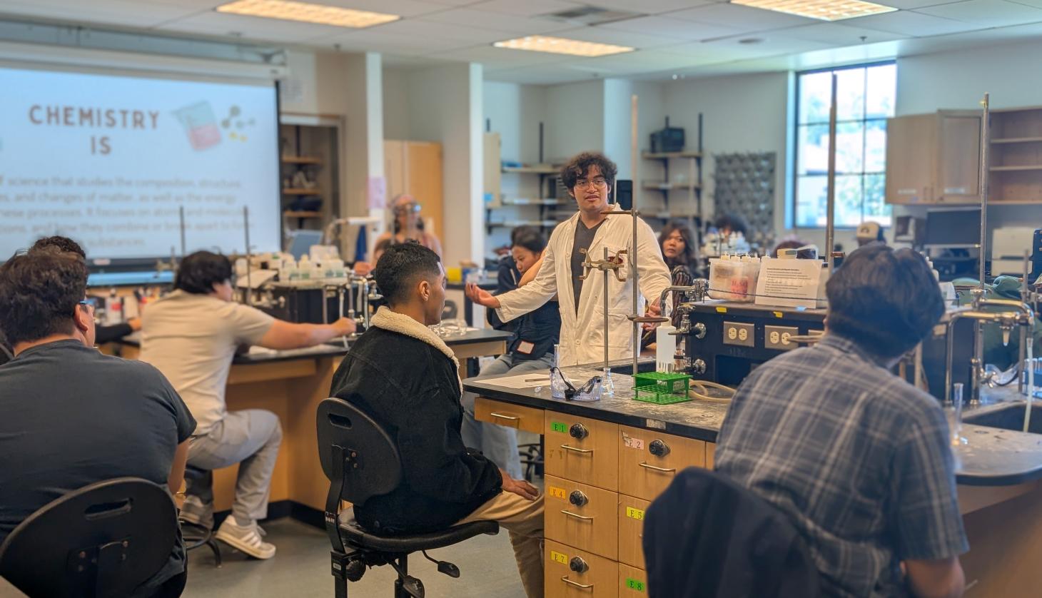Student leading a chemistry workshop
